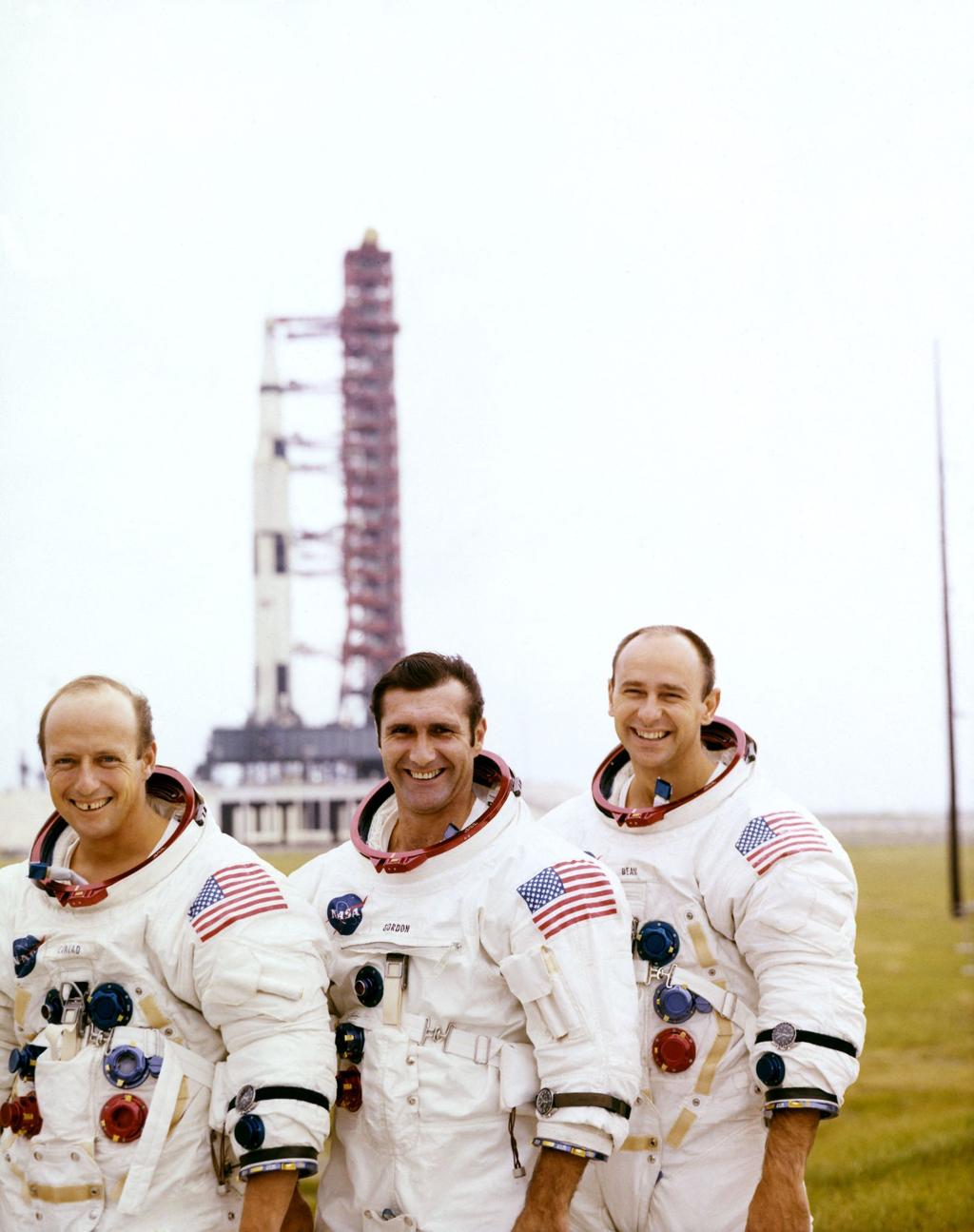 Apollo 12 photograph 3: NASA — Apollo 12 crew reviewing mission photographs aboard USS Hornet. (NASA, public domain)