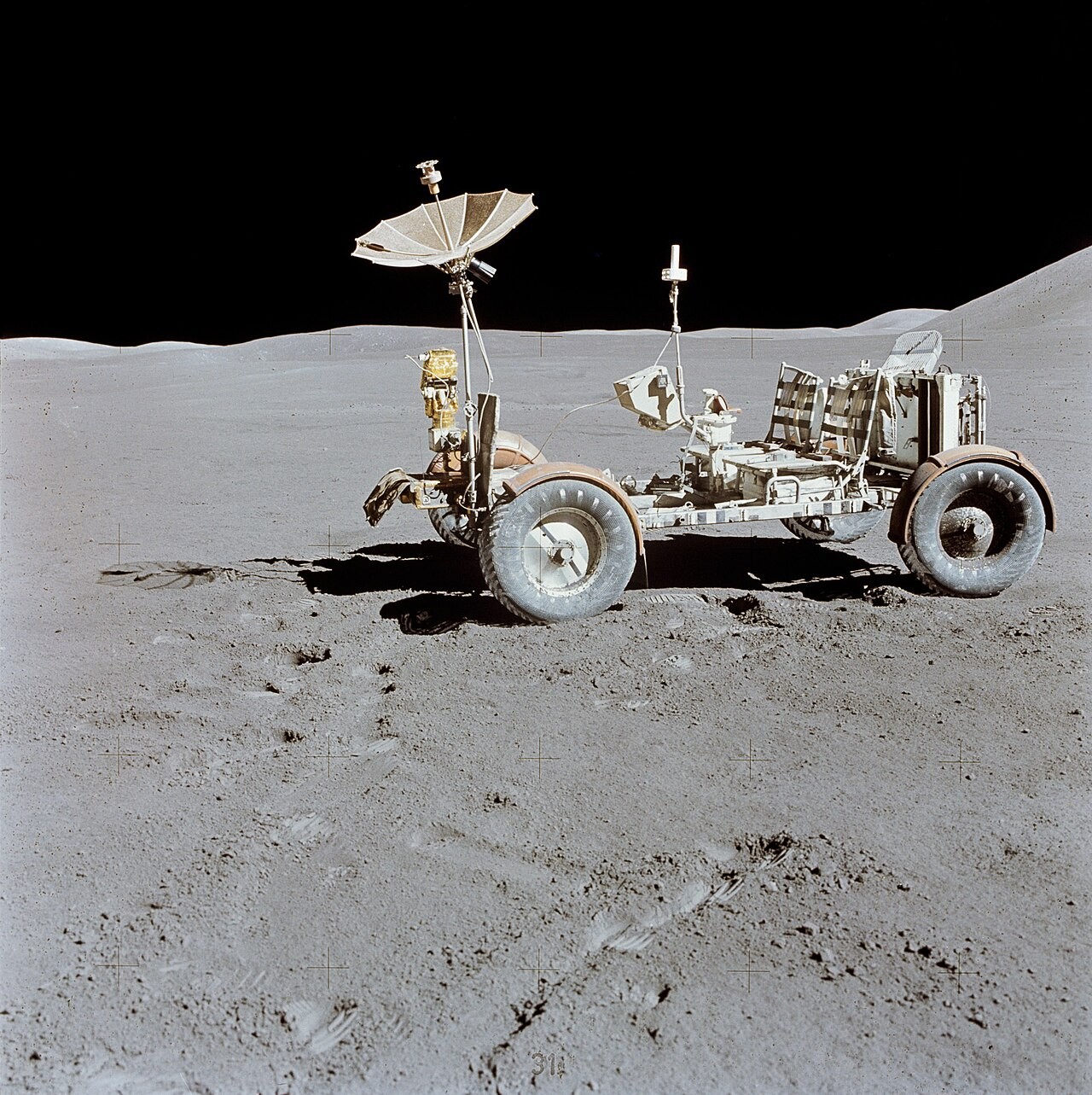 Apollo 15 photograph 3: NASA — Lunar Roving Vehicle parked overlooking Hadley Rille, Apollo 15, August 1971. (NASA, public domain)
