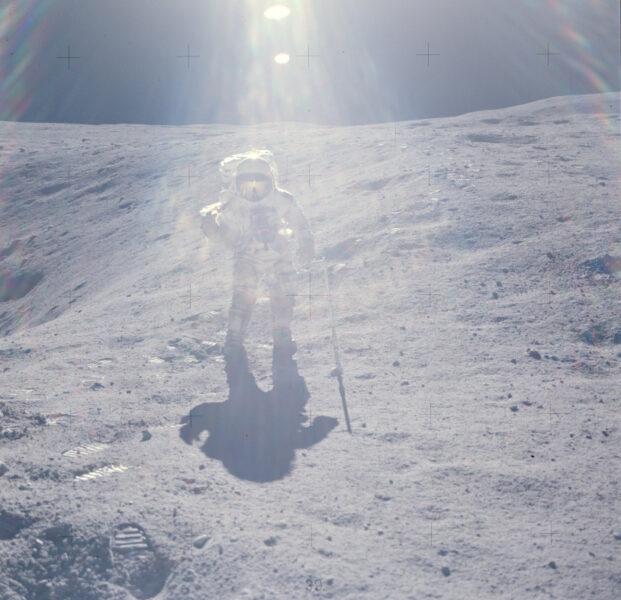 Apollo 16 photograph 2: NASA AS16-113-18339 — Charles Duke beside large lunar boulder, Descartes Highlands, Apollo 16, April 1972. (NASA, public domain)